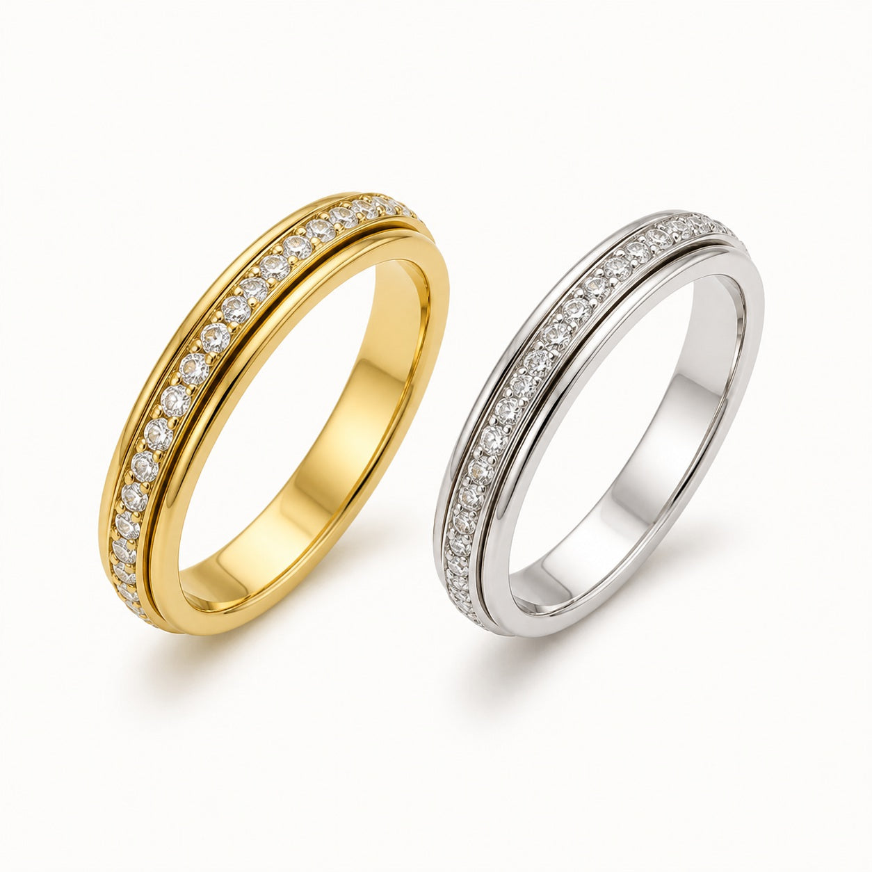 Gold and silver lab moissanite spinner rings on white background - Vowmira lab-grown diamond jewelry